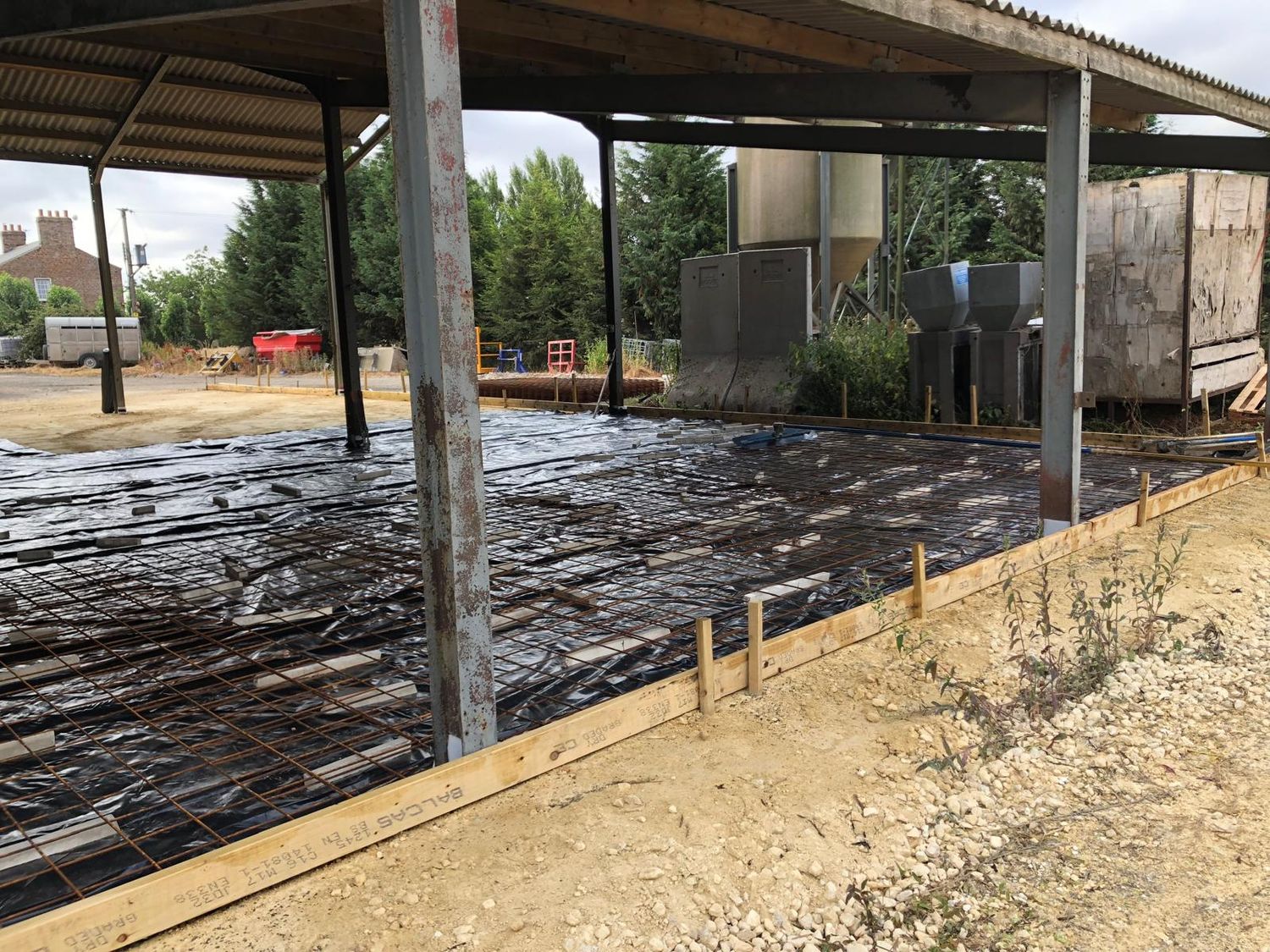 Mesh and membrane in place under an agricultural canopy