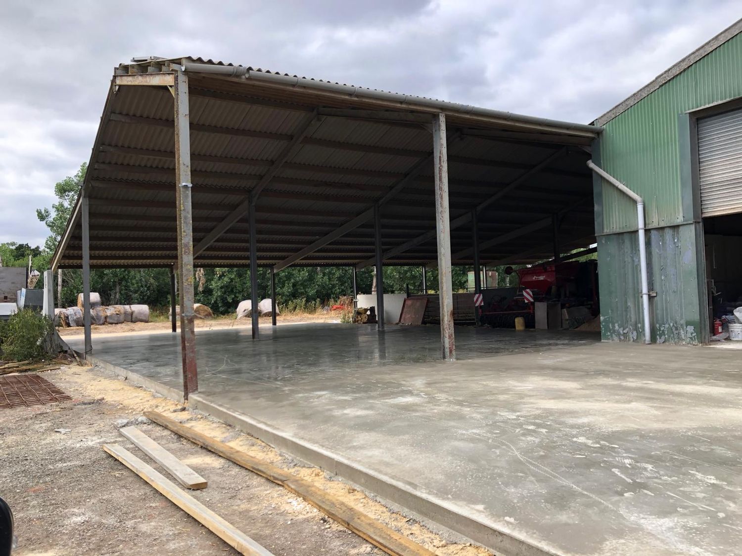 Finished floor slab under an agricultural canopy