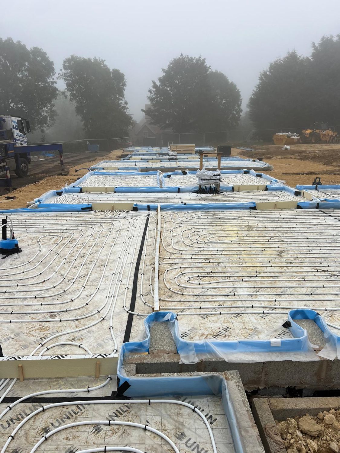 Underfloor heating pipework on insulation ahead of the screed