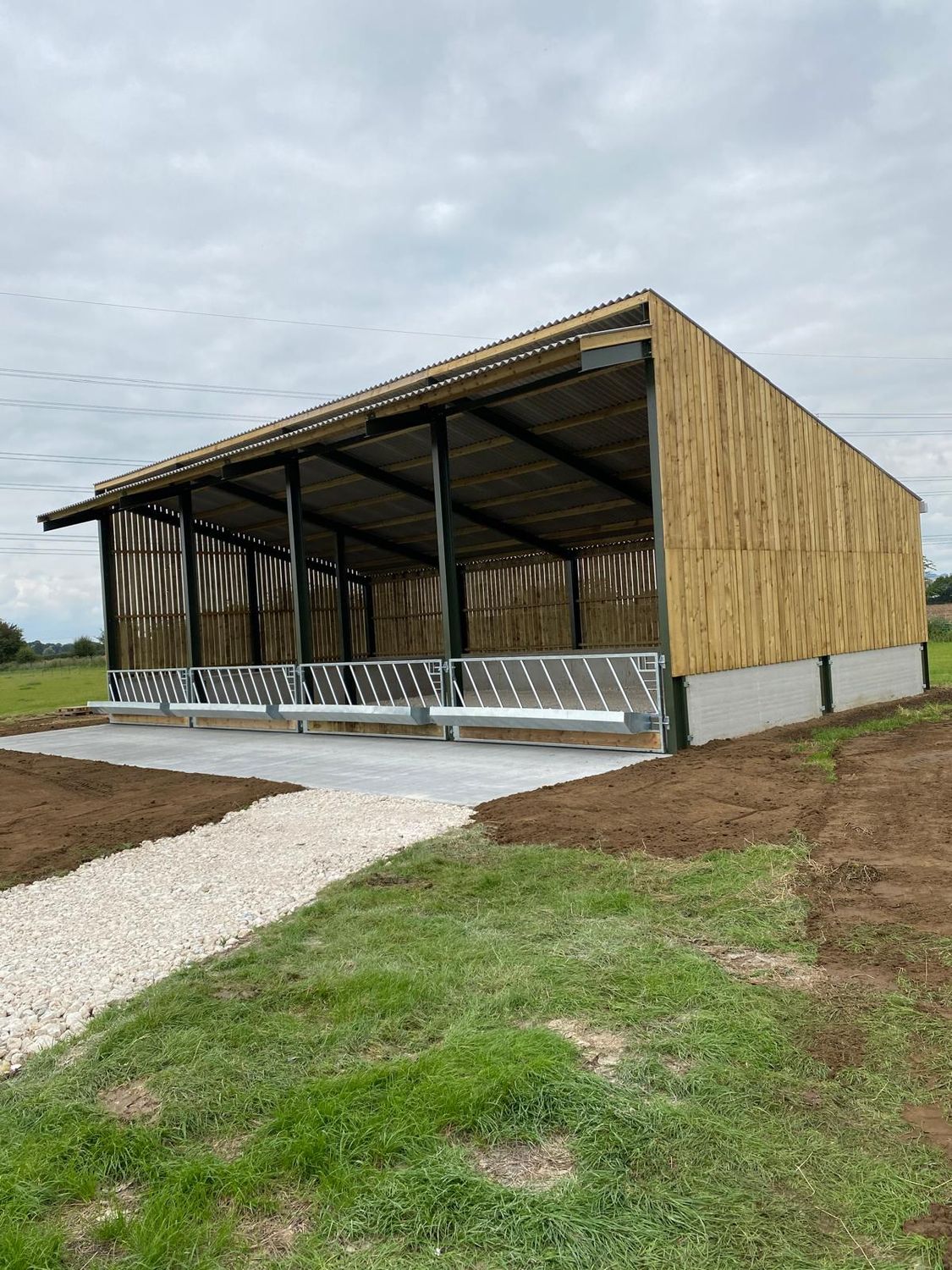 Open fronted cattle shed with timber cladding