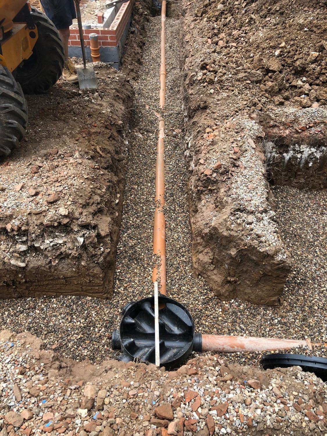 Drainage run and inspection chamber beside new foundations