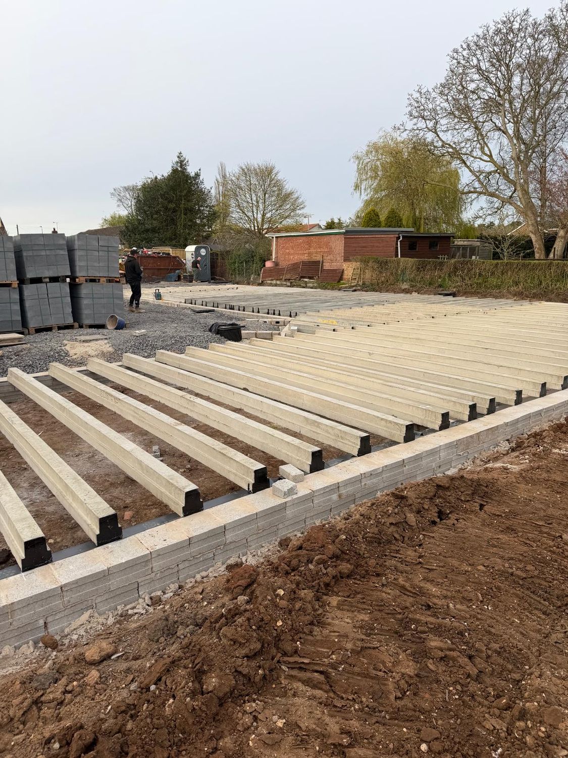Precast floor beams laid on the substructure walls