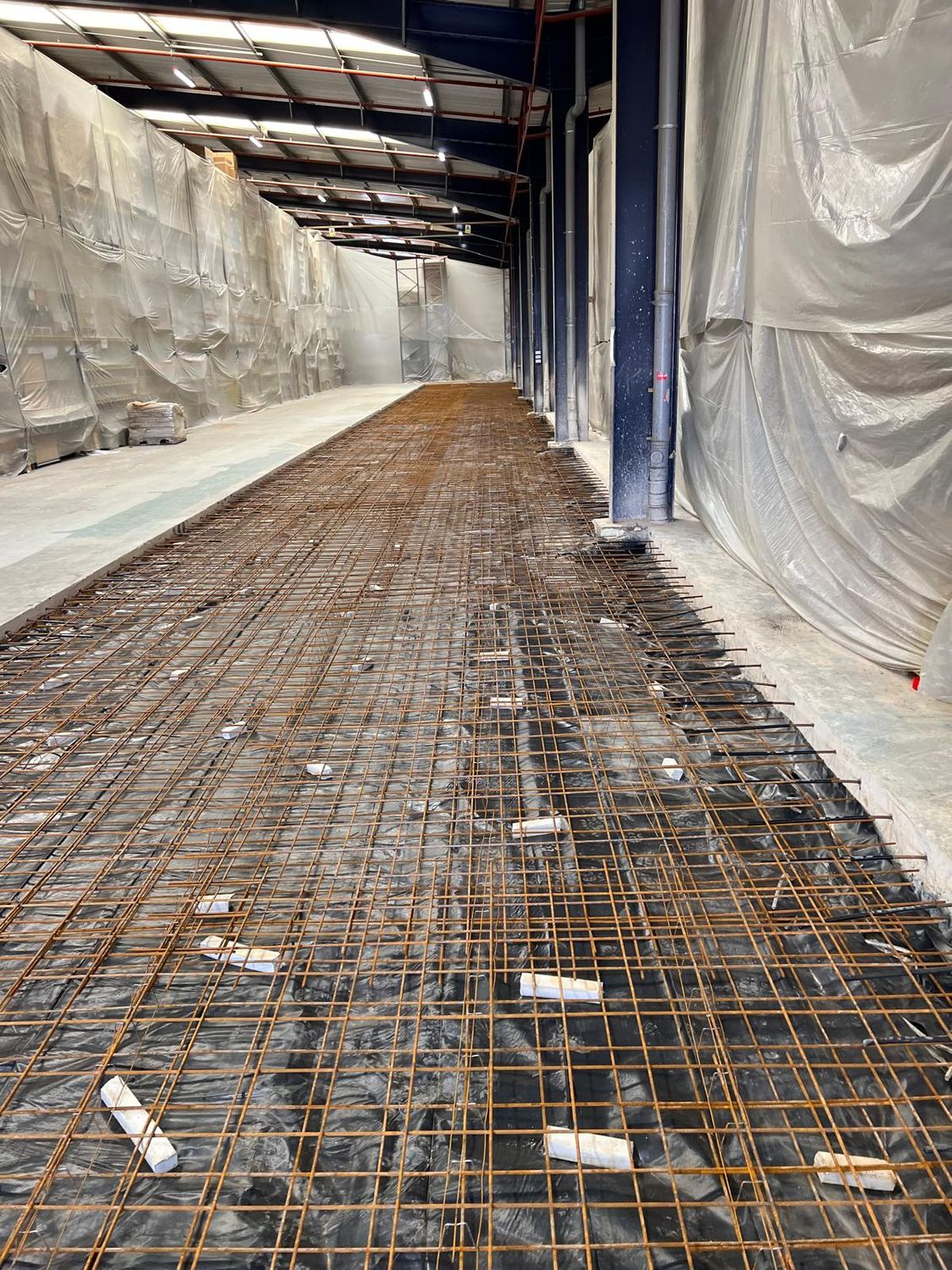 Mesh reinforcement for a replacement factory floor slab