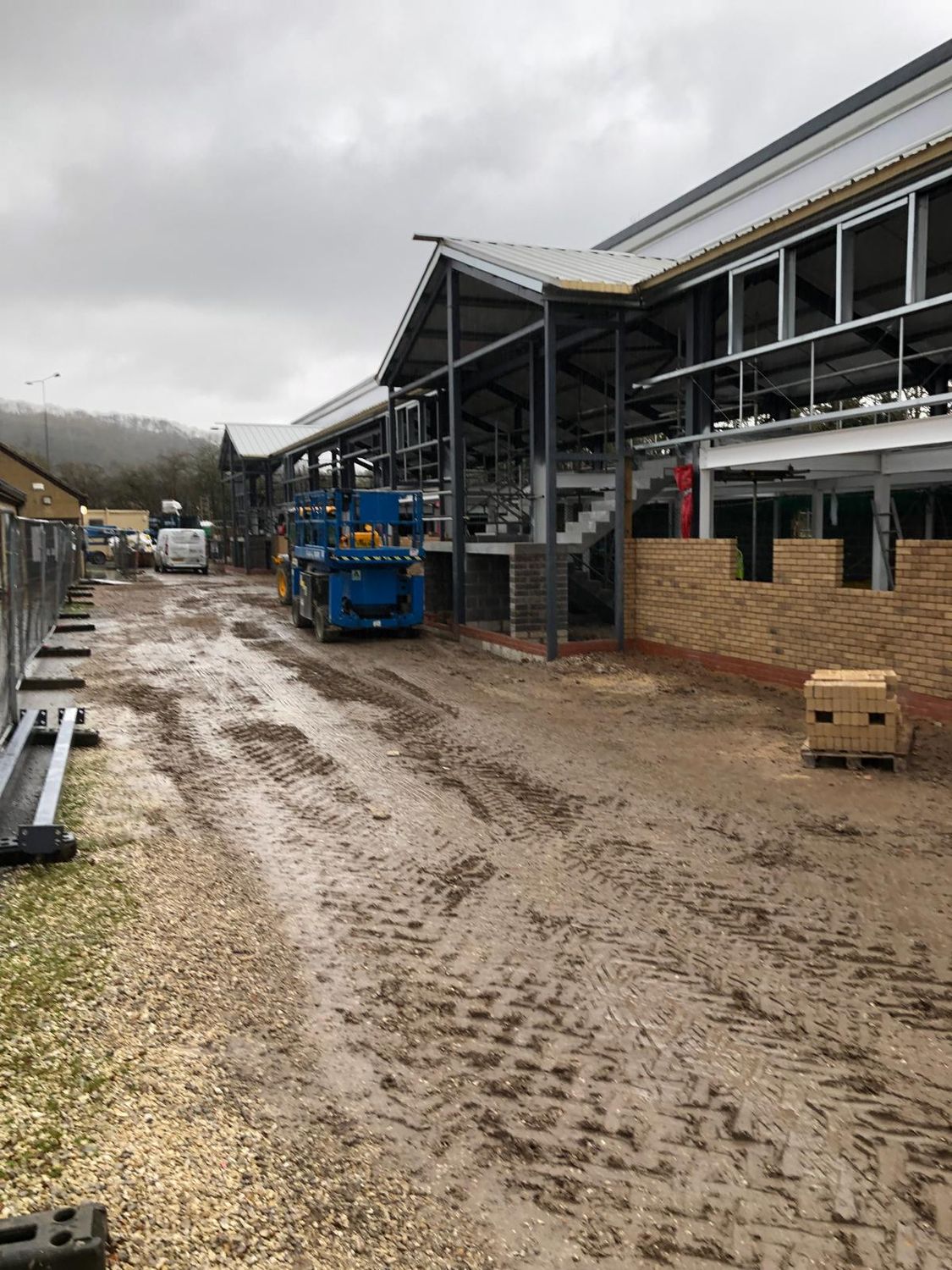 Steel frame and brick plinth walls under construction