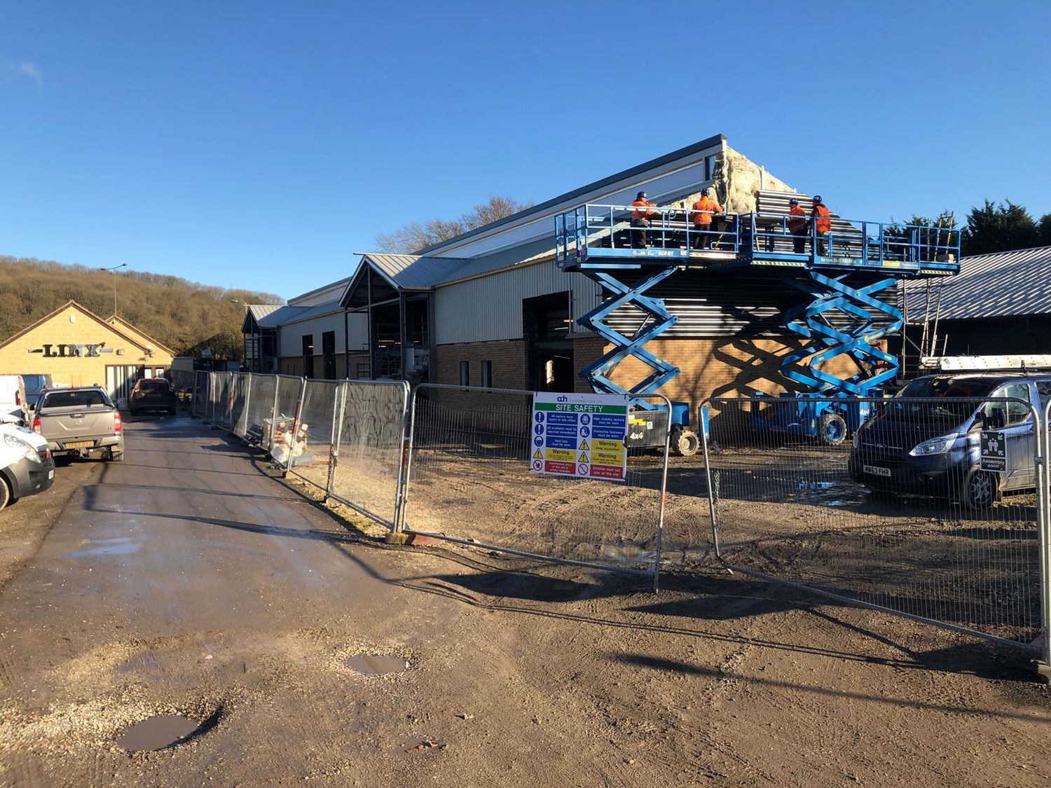 Cladding being fitted from access platforms
