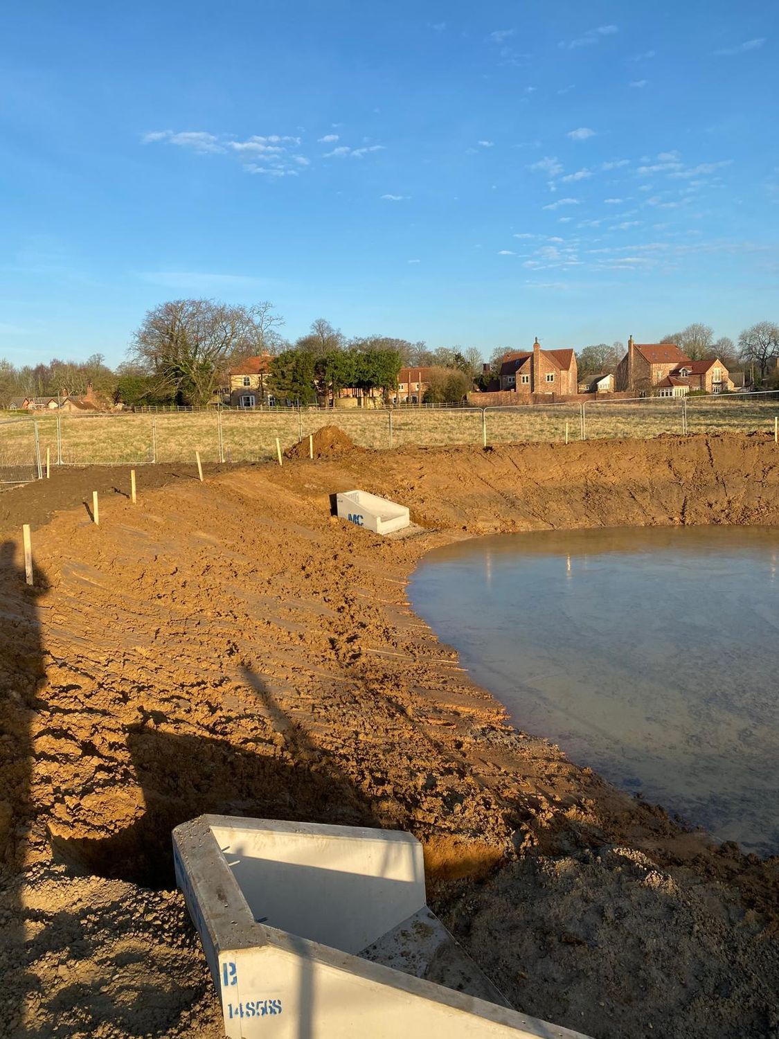 Headwall set into the bank of the attenuation pond