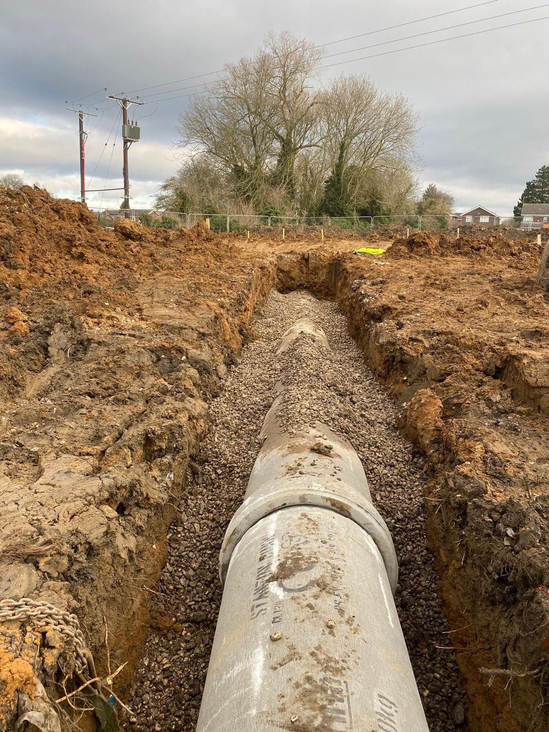 Large diameter concrete pipe laid in a trench