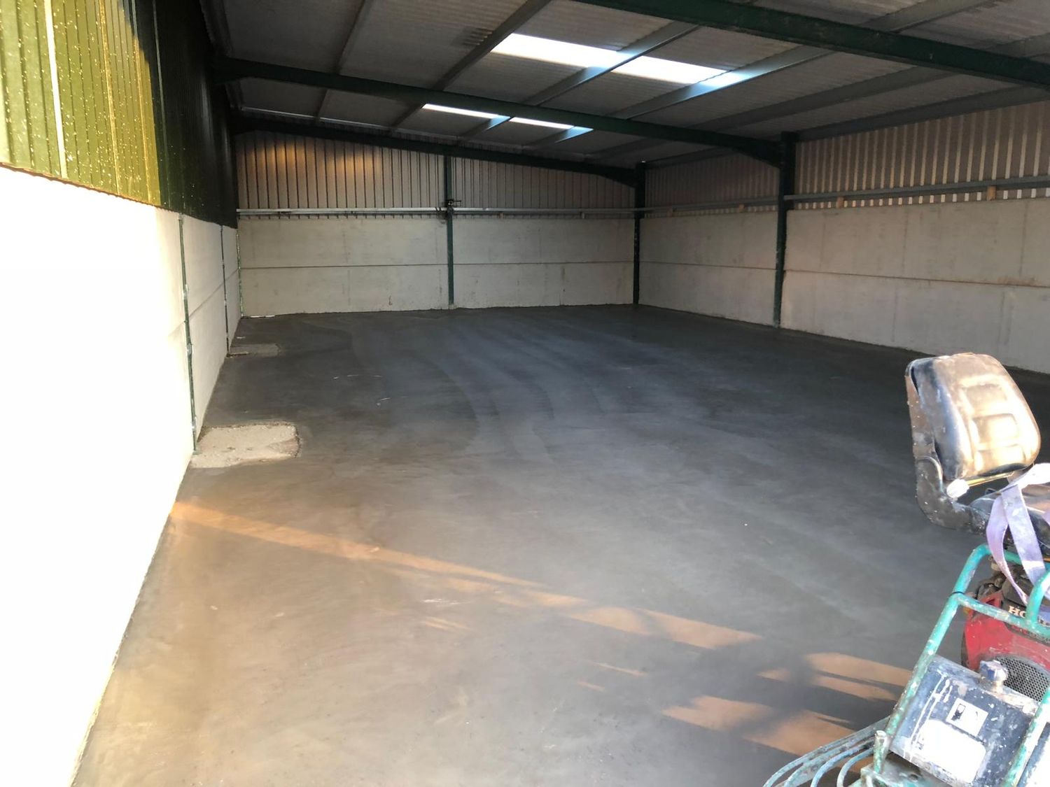 Concrete floor inside a steel framed building