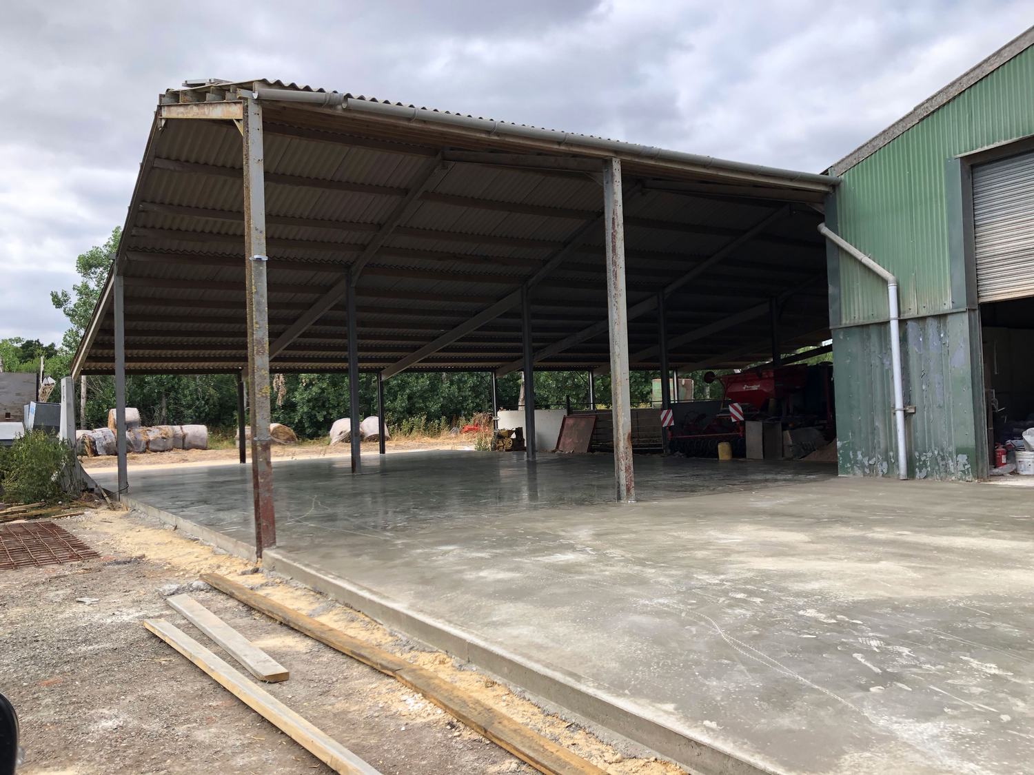 Concrete slab to an open-sided agricultural building